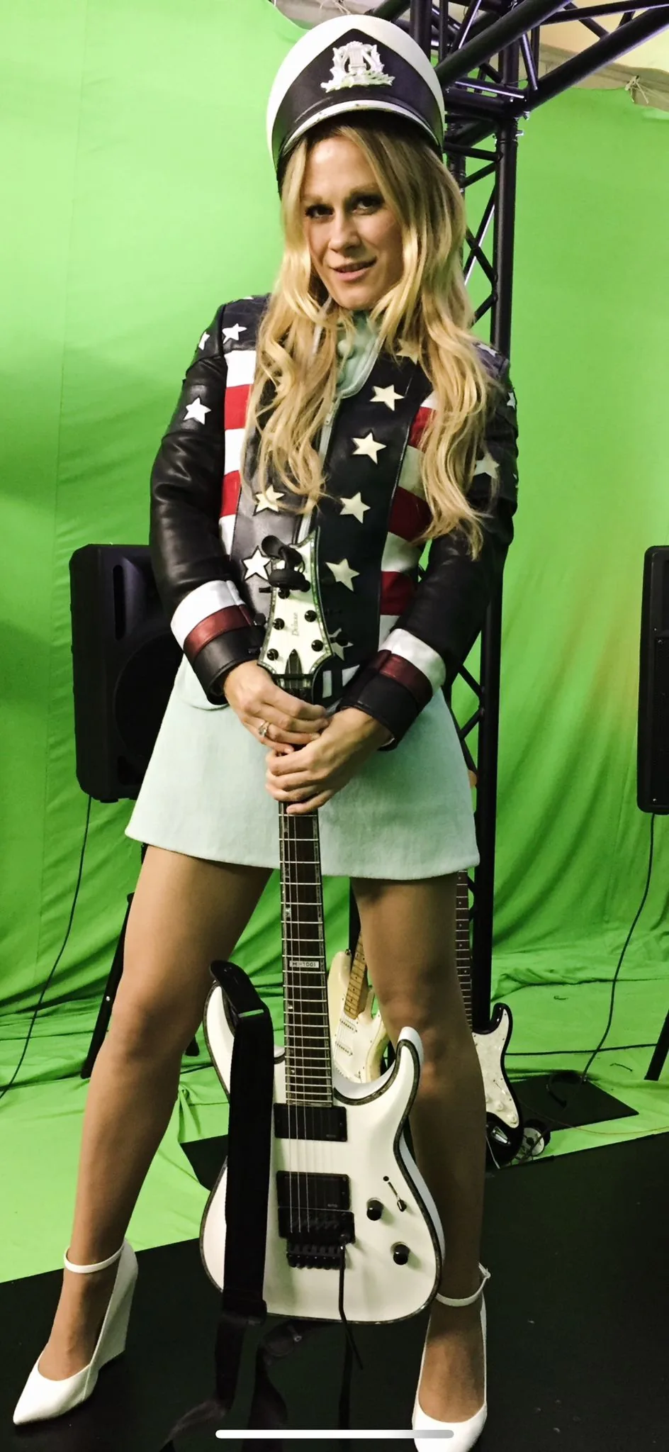 Model with guitar wearing stars & stripes jacket